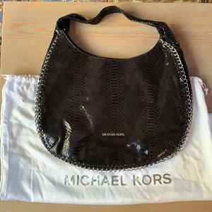 Michael Kors shoulder bag. Black snake skin leather with silver chain link.